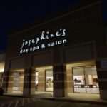 eldridge-1 Exterior view of Josephine's Day Spa & Salon illuminated at night, with large windows displaying the interior. | Josephine's Salons and Spas