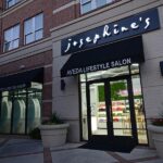 rice-village-11 Brick building exterior in Rice Village with a sign reading "Josephine's Aveda Lifestyle Salon" above the entrance. Large windows display salon products, while three large planters add charm to this vibrant neighborhood staple. | Josephine's Salons and Spas