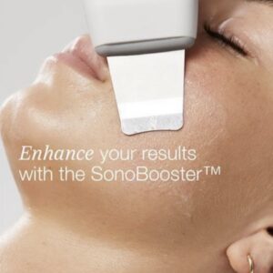 A close-up of a person’s face in a luxury Aveda Houston spa receiving a SonoBooster skin treatment. Text: “Enhance your results with the SonoBooster™.”. | Josephine's Salons and Spas | Houston, TX