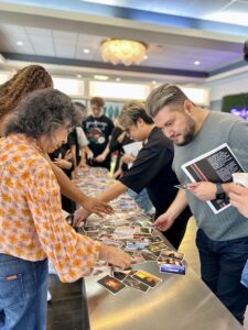 Guests admire beautiful hair at a gathering in a bright Houston indoor space, likely styled at Josephine’s Salon + Spa, a luxurious Aveda salon and spa experience. | Josephine's Salons and Spas | Houston, TX