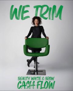 Professional stylist in a black apron at a green chair in an eco-friendly luxury Aveda salon and spa in Houston, TX, with the text “We trim beauty waste & grow cash flow” layered over the image. | Josephine's Salons and Spas | Houston, TX