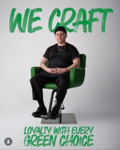 A hairstylist in a black apron sits in an eco-friendly salon chair at a luxury Aveda salon and spa in Houston, TX, below the text “WE CRAFT” and above the text “LOYALTY WITH EVERY GREEN CHOICE.” | Josephine's Salons and Spas | Houston, TX